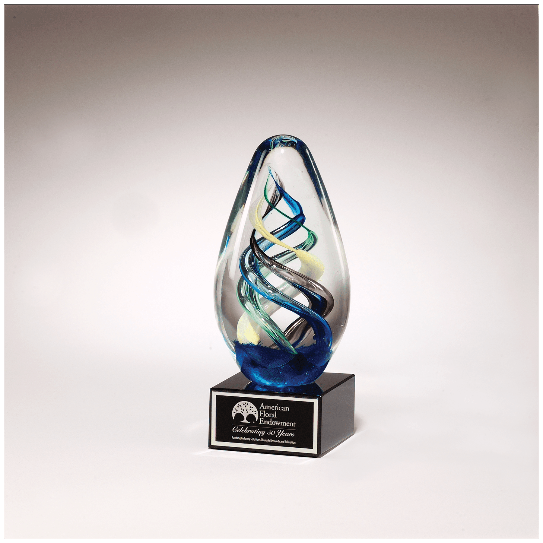 7.1" Egg Shaped Colored Art Glass on Black Glass Base