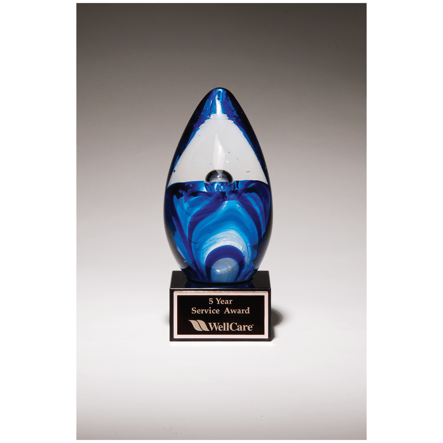 6.5" Blue Egg Shaped Art Glass on Black Glass Base