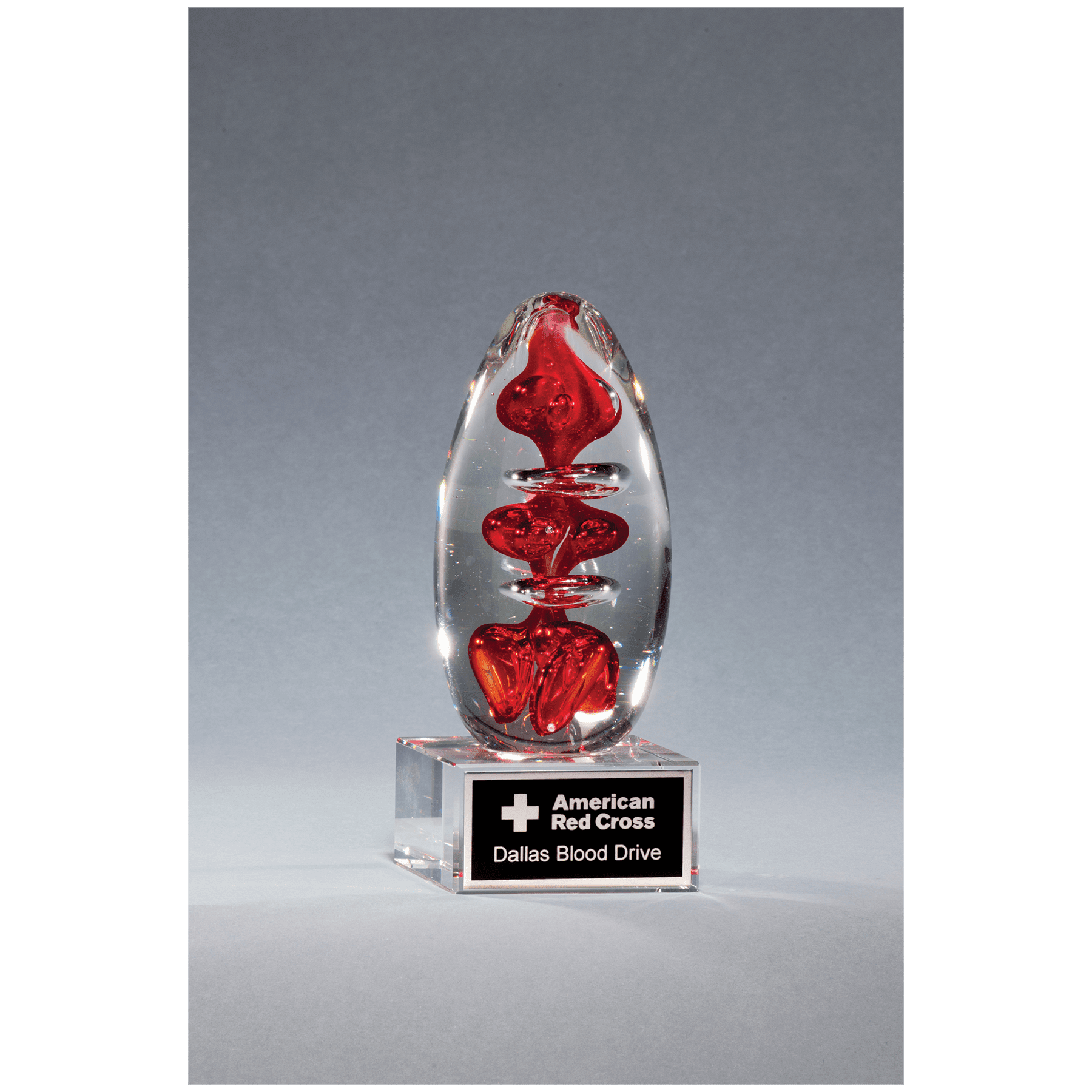 5.25" Red Egg Shaped Art Glass on Clear Glass Base
